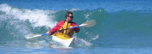 Meridian Cygnet sea kayak surfing.